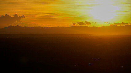 Golden sunset sky clouds in the evening sunrise.
