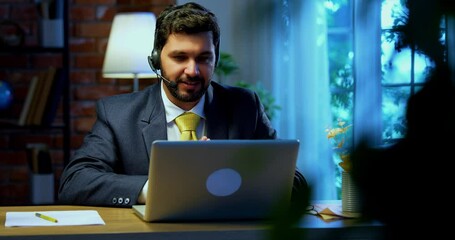 Indian businessman in call centre, Indian Asian corporate executive wearing headset and busy in communication, symbol of customer service, tech support, remote assistance, global connectivity