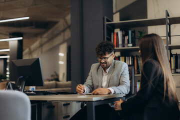 Professional Business Meeting Between Colleagues in a Modern Office Environment