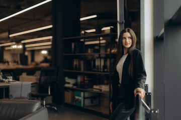 Confident Professional Woman Standing in Modern Office Interior Near Window
