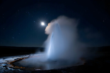 Nighttime Geyser Eruption with Moonlit Sky Beauty