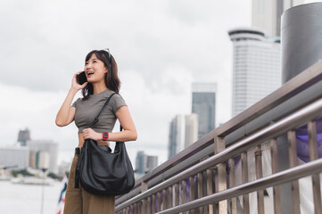 Solo tourism Bangkok Thailand local cultural experience. Happy southeast asian woman teenager...