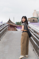 Happy solo Southeast Asian woman teenager blogger and world travel explorer. local cultural tourism...