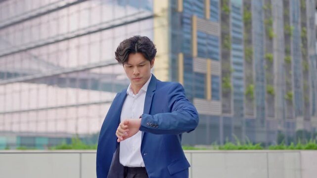 Asian young busy businessman running late to the office workplace.  - Powered by Adobe