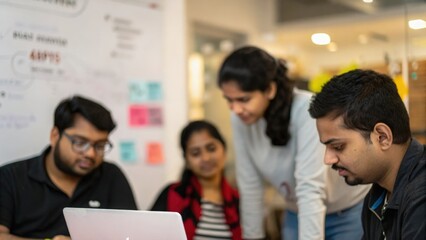 Indian startup team reviewing UI/UX design during product development meeting
