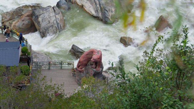 Roaring river rushes through Tiger Leaping Gorge in Shangri-La, Yunnan&mdash;capturing dramatic rapids, rugged cliffs, and tourist views in a legendary Chinese canyon.