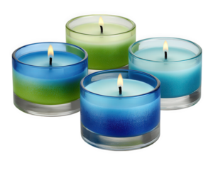 Colorful scented candles in glass containers with blue and green gradient design, burning with soft flame, isolated on transparency background, creating calm and relaxing atmosphere
