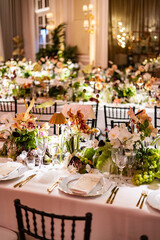 Elegant Wedding Reception with Floral Centerpieces and Golden Light