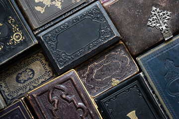 Beautiful old books with covers lie on the table and create a wonderful background for your design. Historical, scientific and religious background.