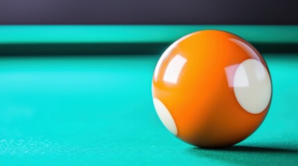 A close-up of a billiard ball near the edge, high detail, blurred background, and top space for copy.