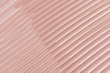 Chic cosmetic background texture of liquid foundation powder in natural tone. delicate parallel stripes. natural highlights of the texture. Layout.