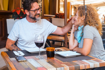 Happy couple enjoying meal at restaurant – romantic date, vacation mood, weekend vibes,...