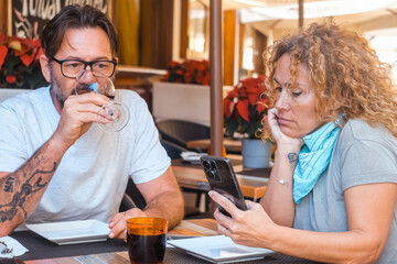 Happy couple enjoying meal at restaurant – romantic date, vacation mood, weekend vibes, relationship and quality time concept