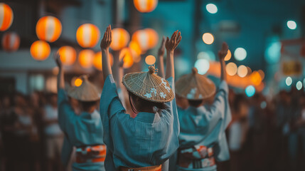 Obraz premium Awa Odori Festival Night Parade with Dancers in Yukata and Traditional Hats Performing in Japanese Summer Festival Street Scene