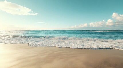 Photograph of turquoise ocean waves gently rolling onto a sandy beach under a bright, sunny sky.