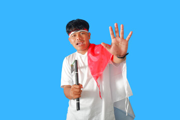 Young Man Holding a Flag and Making a Stop Gesture