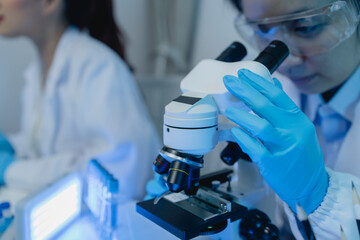 two scientists are working together to find a new antiviral drug, two chemists are using scientific...