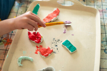 Childrens kids crafts palette colour paint mixing colourful hands