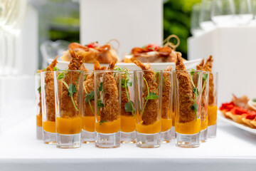 Festive buffet. Table with desserts in glass and snacks. Catering. Buffet. Self-service. Hotel and...