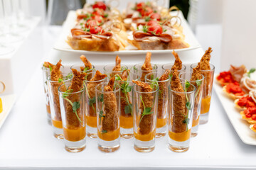 Festive buffet. Table with desserts in glass and snacks. Catering. Buffet. Self-service. Hotel and...
