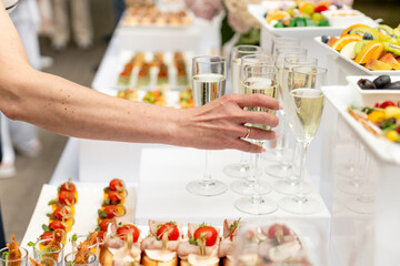 Festive buffet. Table with desserts in glass and snacks. Catering. Buffet. Self-service. Hotel and restaurant services. Wedding buffet