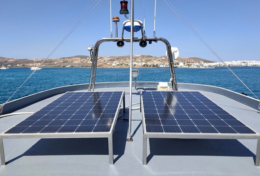 Photo of solar panels installed on a boat deck, capturing renewable energy while sailing across the Aegean Sea from Paros to Antiparos, showcasing sustainable travel in Greece.
