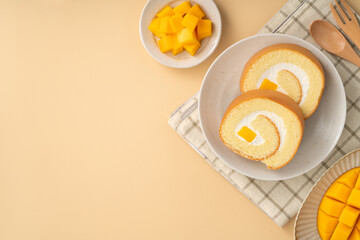 Delicious mango cream Swiss roll cake on plate