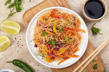 Glass bean noodles salad with vegetables and soy sauce. Gluten free and vegetarian dish. Asian...