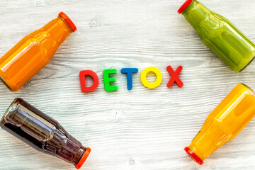 vegetable and fruit juice in bottles for detox drink on white background top view mock up