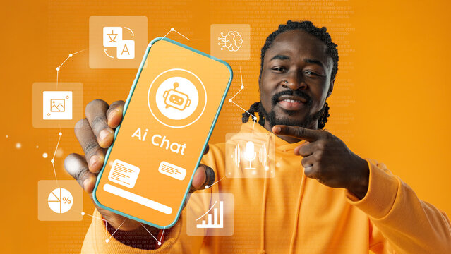 Young man showcases AI chat application on smartphone with vibrant orange background in modern digital environment