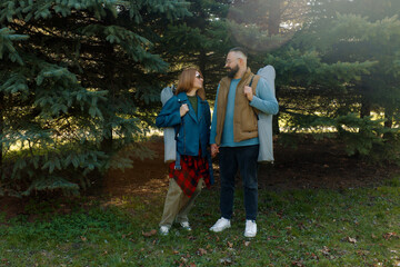 Outdoor couple enjoying a moment together preparing for a relaxing day with folding chairs