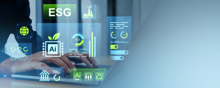 ESG digital dashboard interface concept with sustainability and environmental metrics on transparent screen over businessman typing on laptop in office..