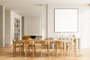 Bright minimalist dining room interior with wooden furniture and large blank poster frame on white...