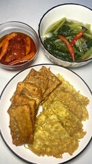 Delicious Indonesian Cuisine: Fried Tofu, Vegetables, and Chili