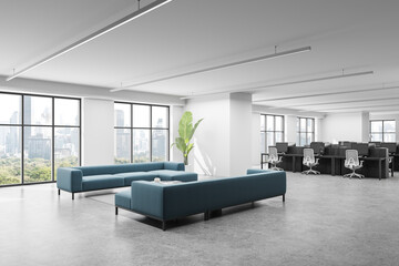 Modern open space office interior with minimalist furniture, panoramic windows, and a city view...