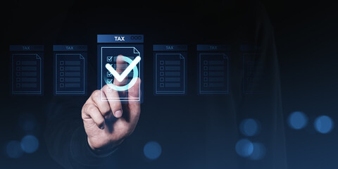 Hand interacting with digital tax document interface with check mark symbol on futuristic screen, illustrating online tax form completion concept.
