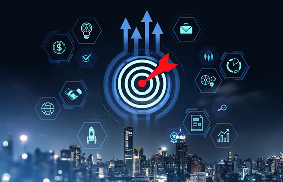 Business target with red dart and digital icons surrounding bullseye over cityscape at night, symbolizing business strategy and goal achievement concept.