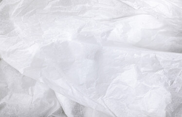 Close-up of white wrinkled fabric texture.