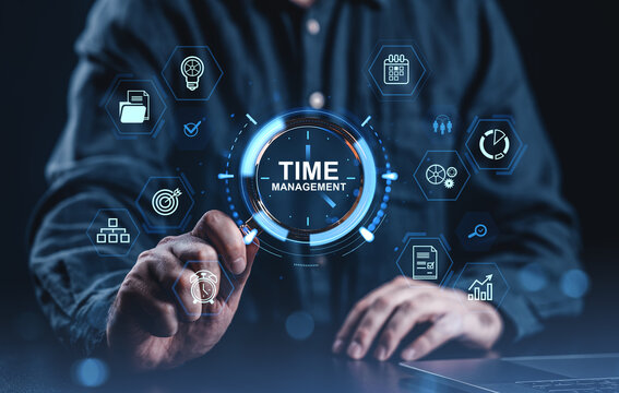 Time management concept with digital icons around businessman using virtual interface on dark background in futuristic business productivity theme.