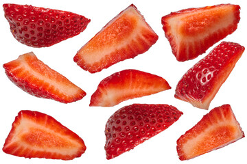 Set of sliced red fresh strawberry wedges arranged in different positions on isolated background.