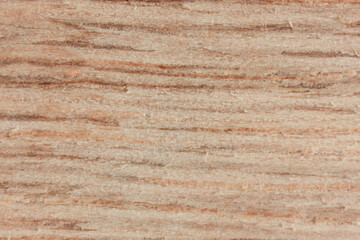 Close-up of a brown wood texture with visible grain patterns.