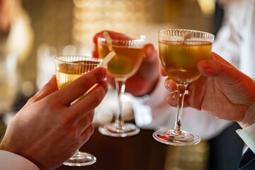 Toasting Cocktails in a Warm Elegant Evening Atmosphere