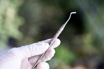 Close-up of dental tools used by dentistry students or interns during clinical practice. Includes...
