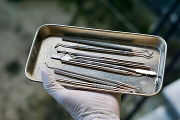 Close-up of dental tools used by dentistry students or interns during clinical practice. Includes...