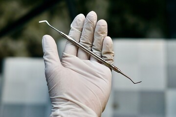 Close-up of dental tools used by dentistry students or interns during clinical practice. Includes...