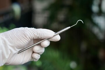 Close-up of dental tools used by dentistry students or interns during clinical practice. Includes...