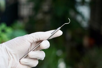Close-up of dental tools used by dentistry students or interns during clinical practice. Includes...