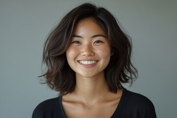 Happy young Asian woman smiling, radiating positivity and joy, isolated on a neutral background, Generative AI