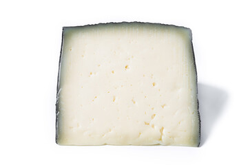 Close-up of a wedge of semi-cured cow's cheese isolated on white background.