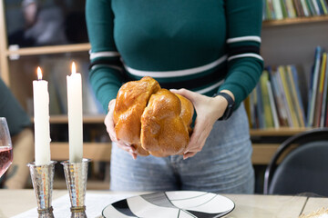 A loaf of bread in a woman's hands